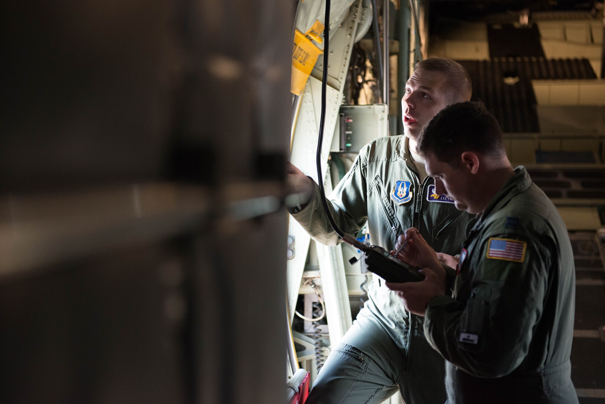 Maj. Lee Place, 934th Airlift Wing C-130 pilot,  and Tech. Sgt. Jesse Kupka, loadmaster, go over pre-flight preparations during exercise Swift Response 15 at Ramstein AB, Germany. (U.S. Air Force Photo by Staff Sgt. Trevor Saylor/Released)