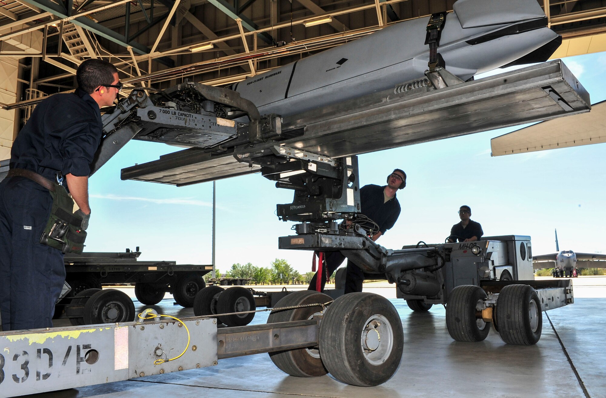 Members of the 5th Aircraft Maintenance Squadron maneuver a “jammer” to transport weapon systems to the wing of a B-52H Stratofortress at Minot Air Force Base, N.D., Aug. 24, 2015. The group was required to load four weapons onto the aircraft as part of Air Force Global Strike Command’s Global Strike Challenge Competition -- a task they completed in approximately 60 minutes. (U.S. Air Force photo/Senior Airman Stephanie Morris)