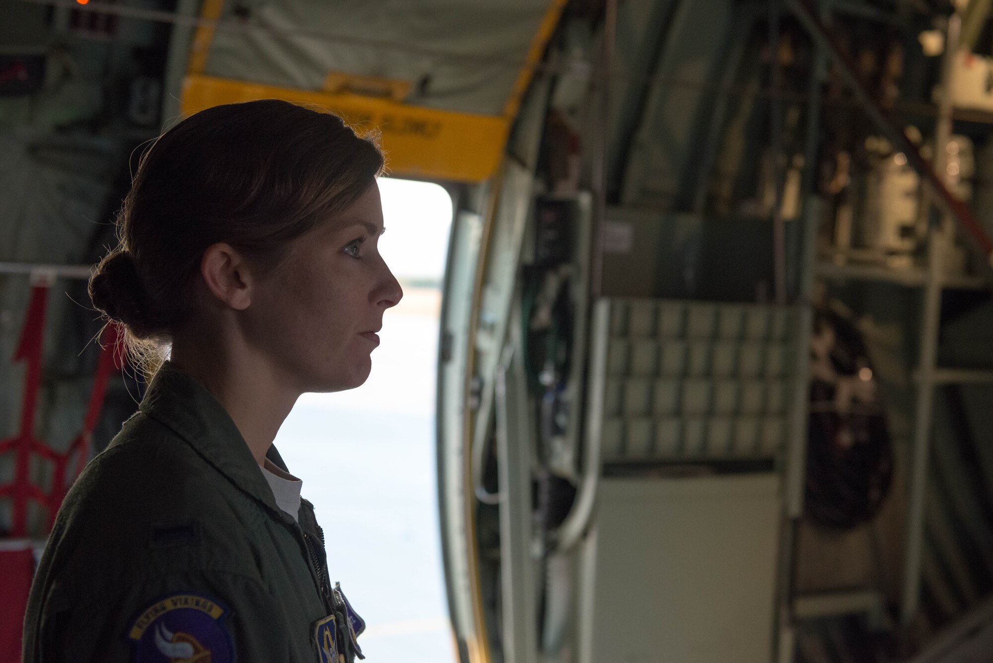 1st Lt. Alicia Makoutz, 96th Airlift Squadron pilot, listens to pre-flight instructions before a mission during exercise Swift Response 15 at Ramstein AB, Germany. (U.S. Air Force Photo by Staff Sgt. Trevor Saylor/Released)