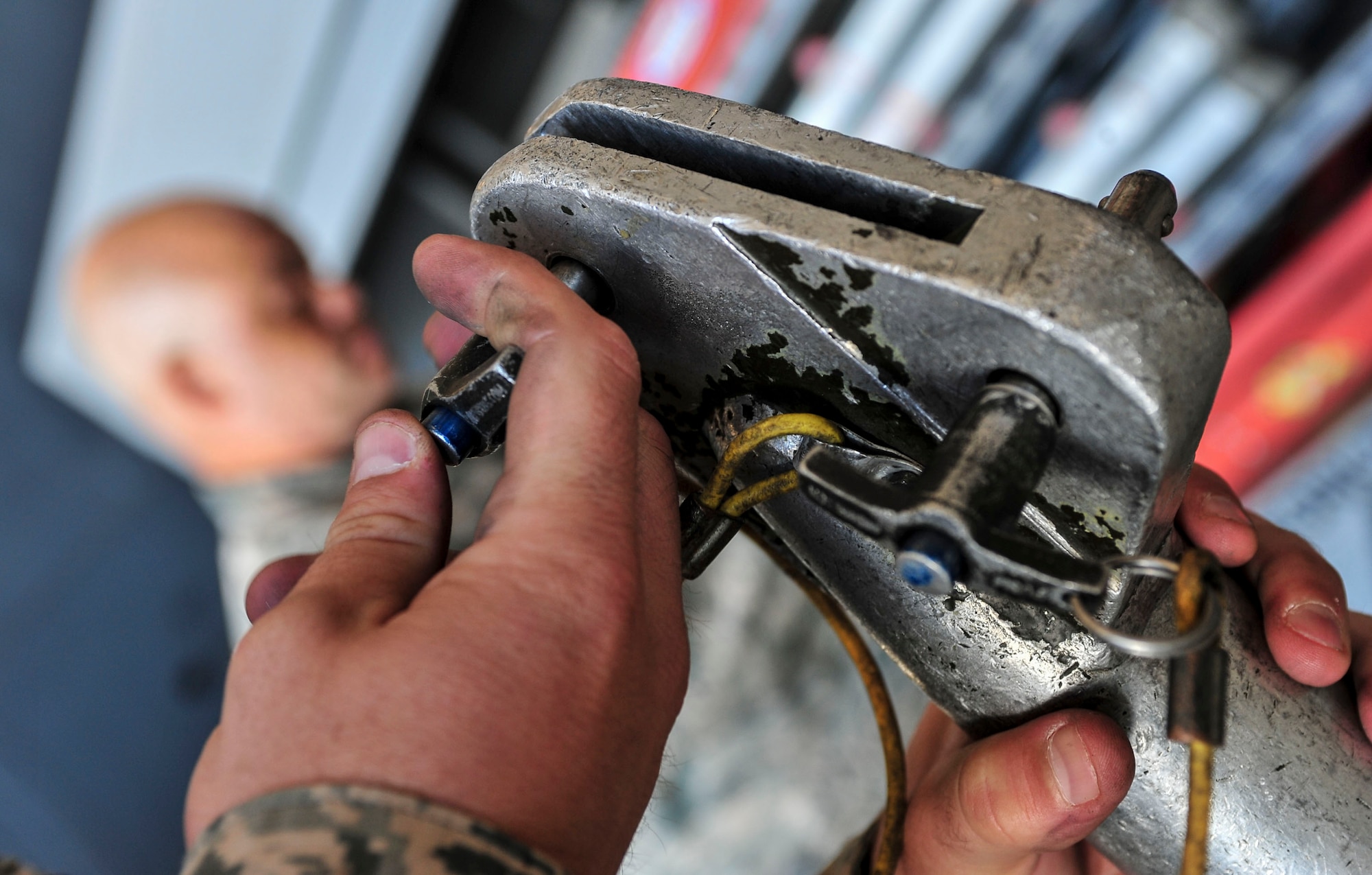 Master Sgt. Jeffrey Thompson, Air Force Global Strike Command Global Strike Challenge Competition evaluator, inspects a piece of bomb loading equipment at Minot Air Force Base, N.D., Aug. 24, 2015. Thompson was one of two evaluators present to judge the bomb loading portion of the competition. (U.S. Air Force photo/Senior Airman Stephanie Morris)