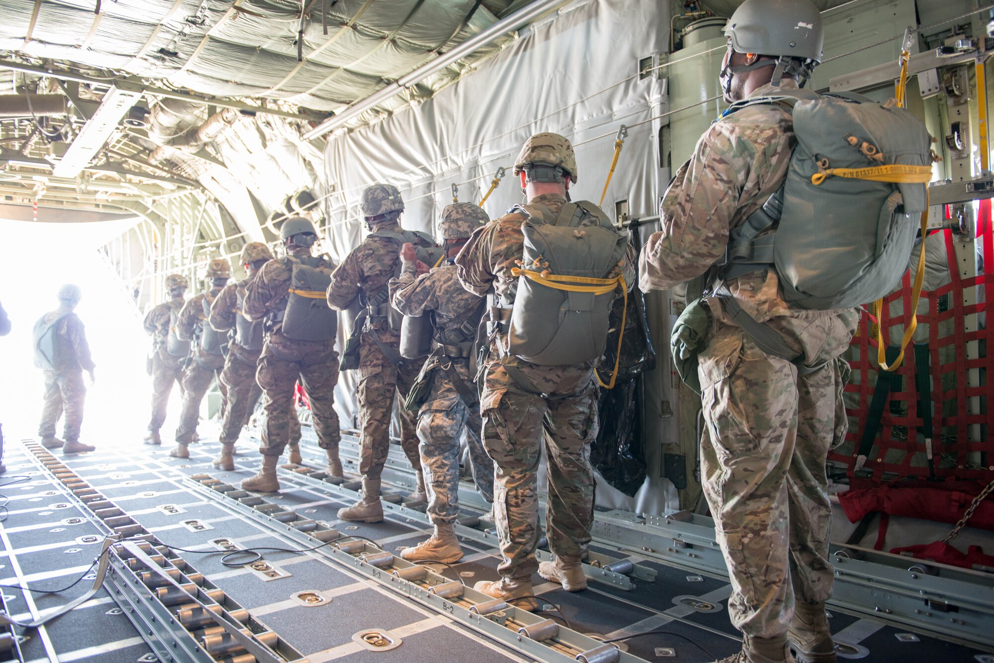 Members of the 5th Quartermaster Theater Aerial Delivery Company prepare to jump from a 934th Airlift Wing C-130 during an airdrop at Ramstein AB, Germany during exercise Swift Response 15. (U.S. Air Force photo by Staff Sgt. Trevor Saylor/Released)