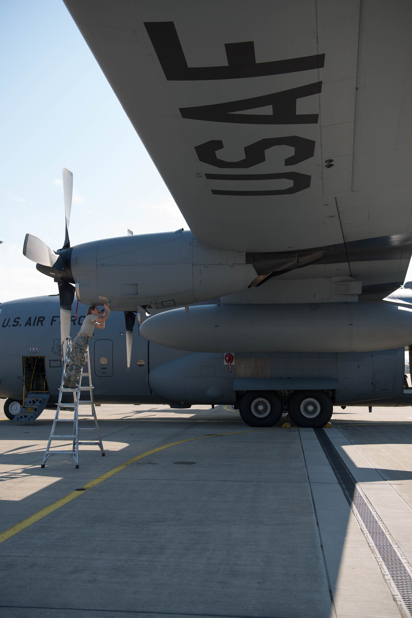 Senior Airman Sara Anderson, 934th Aircraft Maintenance Squadron, conducts a basic post-flight inspection on a 934th C-130 at Ramstein AB, Germany during exercise Swift Response 15. (U.S. Air Force photo by Staff Sgt. Trevor Saylor/Released)