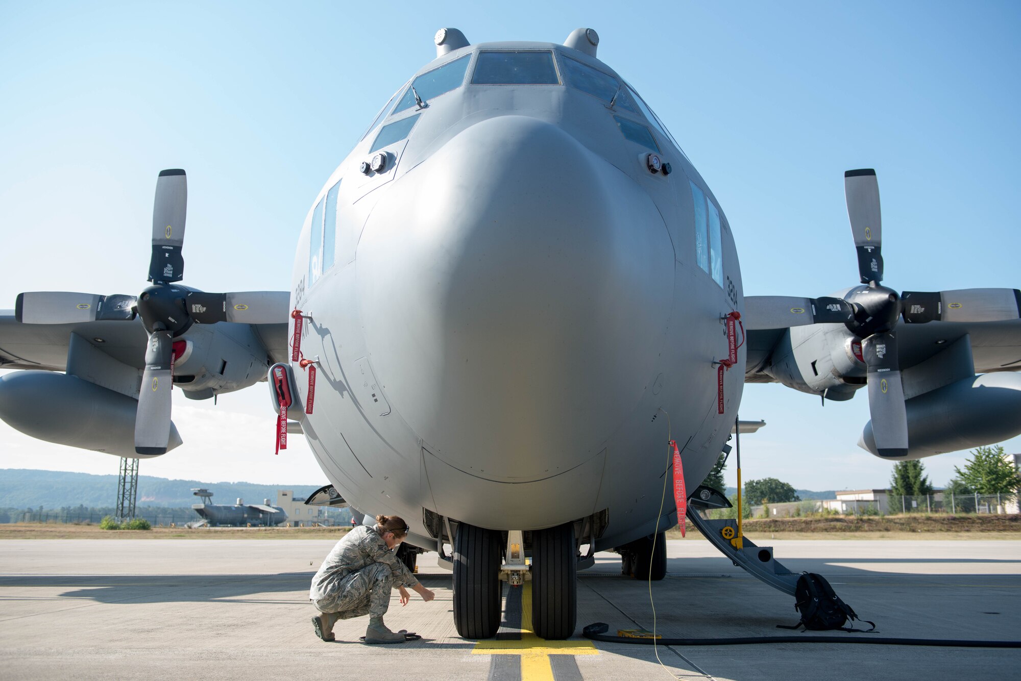 Senior Airman Sara Anderson, 934th Aircraft Maintenance Squadron, checks the tire pressure on a C-130 as part of a basic post-flight inspection at Ramstein AB, Germany during exercise Swift Response 15. (U.S. Air Force photo by Staff Sgt. Trevor Saylor/Released)
