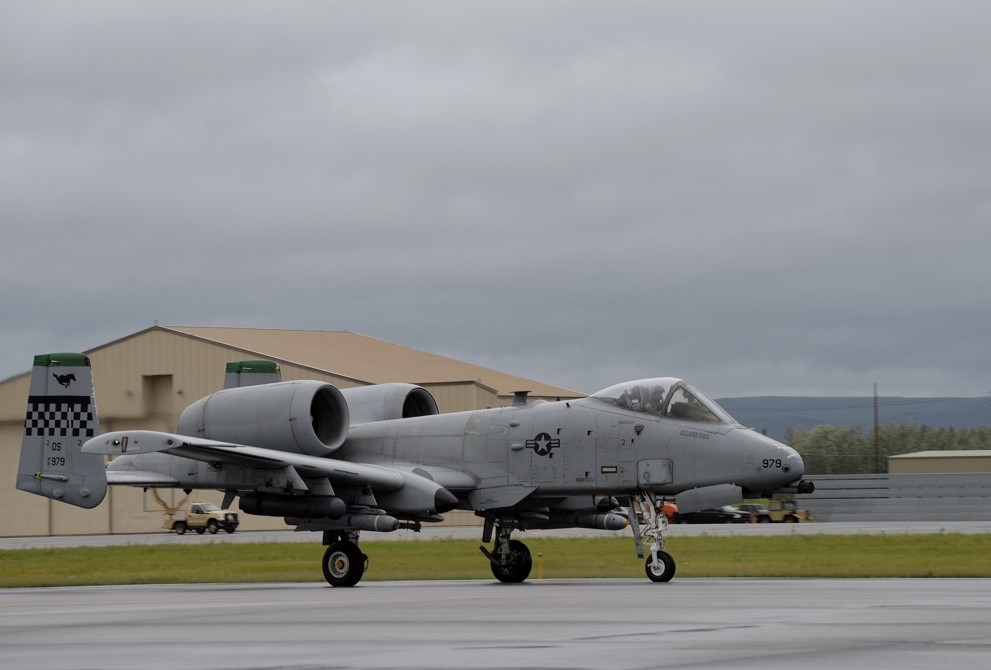 A U.S. Air Force A-10 Thunderbolt II aircraft with the 25th Fighter Squadron from Osan Air Base, Republic of Korea, taxis to Eielson Air Force Base, Alaska, runway Aug. 10, 2015, for launch during the first simulated combat sortie of RED FLAG-Alaska (RF-A) 15-3. The Osan A-10s, as well as several F-16 Fighting Falcons from Osan's 36th Fighter Squadron, are deployed to Eielson for RF-A, a series of Pacific Air Forces commander-directed field training exercises for U.S. and partner nation forces, providing combined offensive counter-air, interdiction, close air support, and large force employment training in a simulated combat environment. (U.S. Air Force photo by Master Sgt. Karen J. Tomasik/Released)
