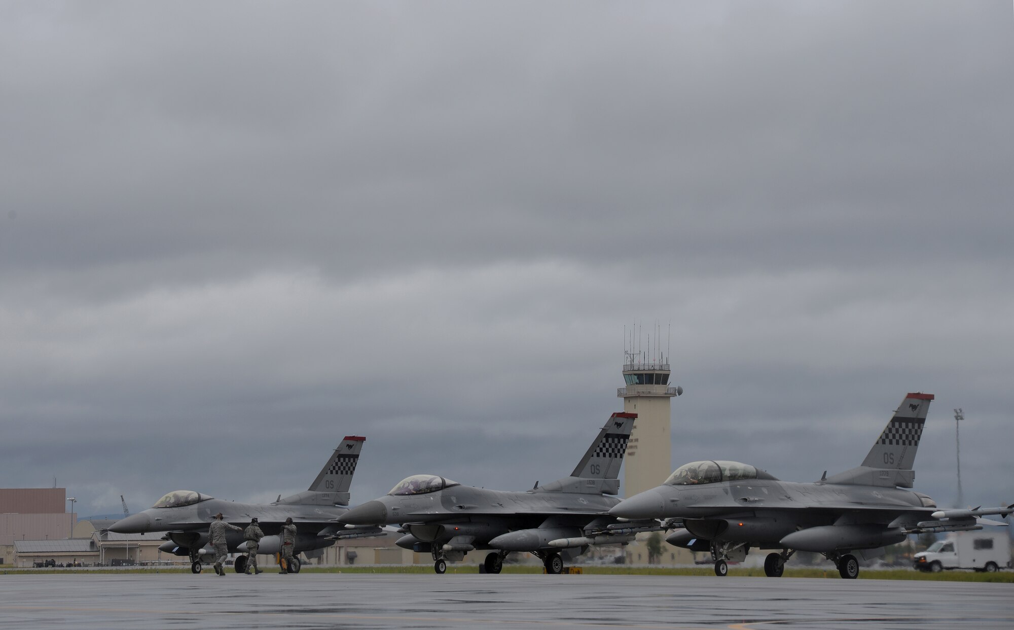 U.S. Air Force maintenance Airmen line up F-16 Fighting Falcons deployed from Osan Air Base, Republic of Korea, to Eielson Air Force Base, Alaska, for the first simulated combat sortie of RED FLAG-Alaska 15-3, Aug. 10, 2015. The Osan F-16s from the 36th Fighter Squadron, as well as several A-10 Thunderbolt II aircraft from Osan's 25th Fighter Squadron, are deployed to Eielson for RF-A, a series of Pacific Air Forces commander-directed field training exercises for U.S. and partner nation forces, providing combined offensive counter-air, interdiction, close air support and large force employment training in a simulated combat environment. (U.S. Air Force photo by Master Sgt. Karen J. Tomasik/Released)