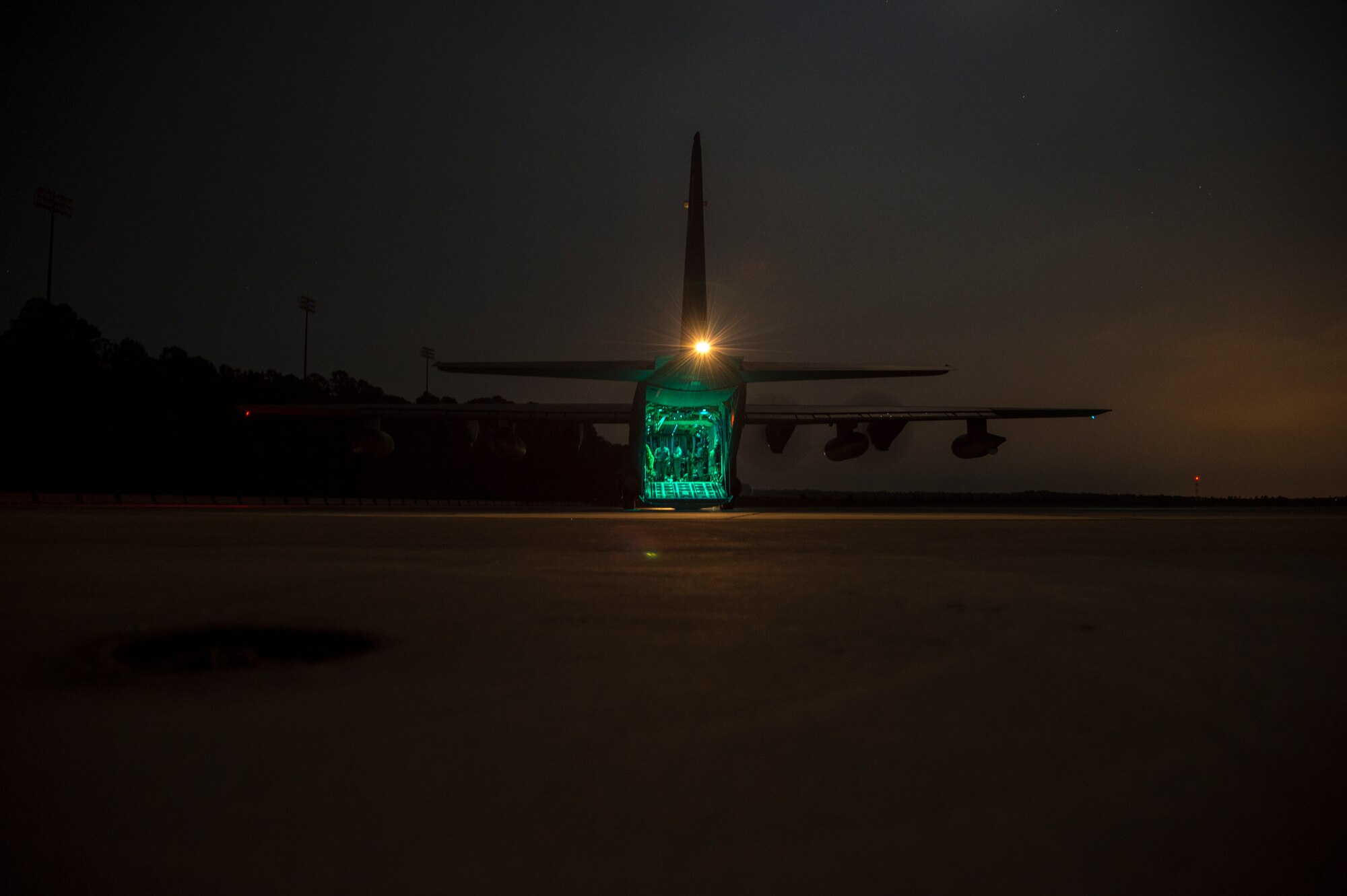 A HC-130J Combat King II engages its engines for take-off after loading 820th Base Defense Group Airmen for a static-line drop August 25, at Moody Air Force Base, Ga. A total of 13 Airman from the 820th BDG participated in the jump. (U.S. Air Force photo by Staff Sgt. Eric Summers Jr./Released)