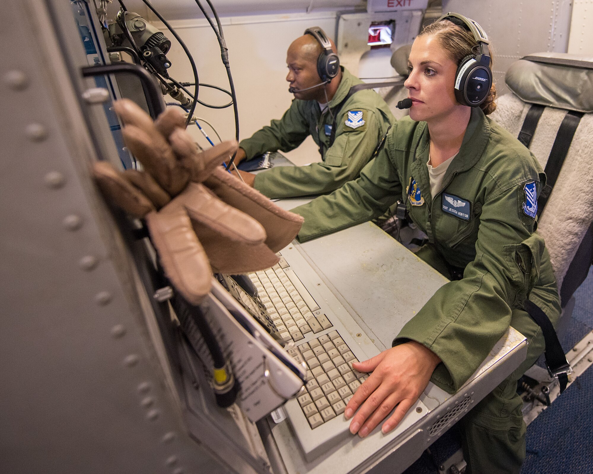 U.S. Air Force Staff Sgt. Jessica Horton, right, and Master Sgt. Ken Menefee, communication systems technicians with the 116th Air Control Wing (ACW), Georgia Air National Guard, monitor tracking data from their operator work station aboard an E-8C Joint STARS during a mission in the Boars Nest 2015 exercise, Robins Air Force Base, Ga., Aug. 20, 2015. The 116th ACW hosted the eight annual Boars Nest Large Force Exercise bringing together more than 20 joint-force units and 55 different aircraft for aircrew training in a realistic land and maritime threat environment. Crews flying the E-8C Joint STARS manned platform, used their unique battle management, command and control, intelligence, surveillance and reconnaissance capabilities, integrated with other Air National Guard, Air Force, Navy, and Marine aircraft, to complete maritime and land-based missions during the exercise. (U.S. Air National Guard photo by Senior Master Sgt. Roger Parsons/Released)