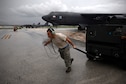 Staff Sgt. Stephen Cole, a B-52 Stratofortress crew chief assigned to the 20th Expeditionary Aircraft Maintenance Squadron, moves ground equipment during aircraft launch operations Aug. 22, 2015, at Andersen Air Force Base, Guam. Bomber crews with the 20th Expeditionary Bomb Squadron are part of U.S. Pacific Command’s continuous bomber presence and support ongoing operations in the Indo-Asia-Pacific region. (U.S. Air Force photo/Staff Sgt. Alexander W. Riedel)