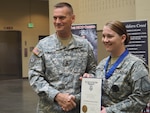 New York Army National Guard Major General Patrick Murphy, the adjutant general of New York, presents the New York State Medal for Valor, the state's highest military award, to Staff Sgt. Marlana Watson, of Lindenhurst, New York, on  Aug. 19, 2015, at the Farmingdale Armed Forces Reserve Center. Watson, a member of the New York Army National Guard's Recruiting and Retention Battalion and a medic, was recognized for rushing across a Syracuse Street on Nov. 5, 2014, to treat two teenagers injured in a drive-by shooting, without regard for her own safety, since the shooter may have still been in the area. 