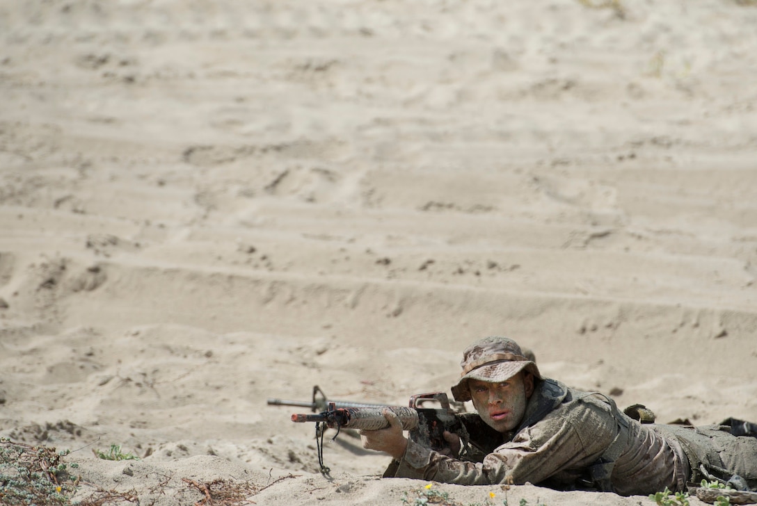 A Marine participates in a beach assault demonstration as Defense Secretary Ash Carter watches during a visit on Camp Pendleton Calif., Aug. 27, 2015. DoD photo by U.S. Air Force Master Sgt. Adrian Cadiz