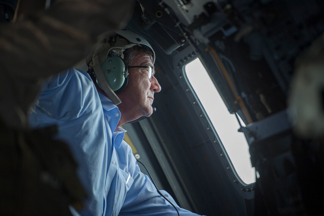 Defense Secretary Ash Carter looks out the window of a Marine Corps V-22 Osprey as he visits Camp Pendleton Calif., Aug. 27, 2015. DoD photo by U.S. Air Force Master Sgt. Adrian Cadiz