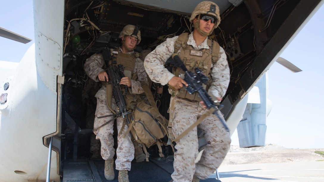 Marines with 2nd Battalion, 1st Marine Regiment exit an MV-22B Osprey with Marine Medium Tiltrotor Squadron (VMM) 166 (Reinforced) during egress training aboard Marine Corps Base Camp Pendleton, California, Aug. 18.  Marines conducted the training as part of the 13th Marine Expeditionary Unit predeployment training. 