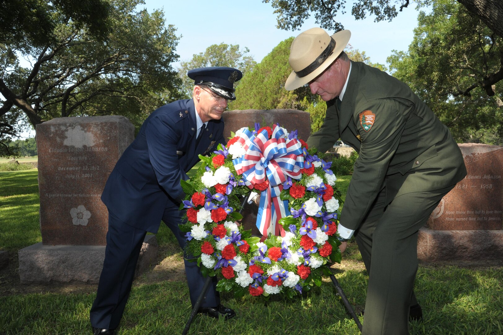 Brig. Gen. Bob LaBrutta (left), 502nd Air Base Wing and Joint Base San Antonio commander, and Russ Whitlock, Lyndon B. Johnson National Historical Park superintendent lay a wreath at the gravesite of President Lyndon B. Johnson during a wreath laying ceremony Aug. 27, 2015 at LBJ National Historical Park. The event is a long-standing tradition sponsored by the National Historical Park Service that honors the only U.S. president born and raised in Texas.