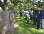 Brig. Gen. Bob LaBrutta, 502nd Air Base Wing and Joint Base San Antonio commander, (right) and Russ Whitlock, Lyndon B. Johnson National Historical Park superintendent salute the grave of President Lyndon B. Johnson during a wreath laying ceremony Aug. 27, 2015 at LBJ National Historical Park. The event is a long-standing tradition sponsored by the National Historical Park Service that honors the only U.S. president born and raised in Texas.