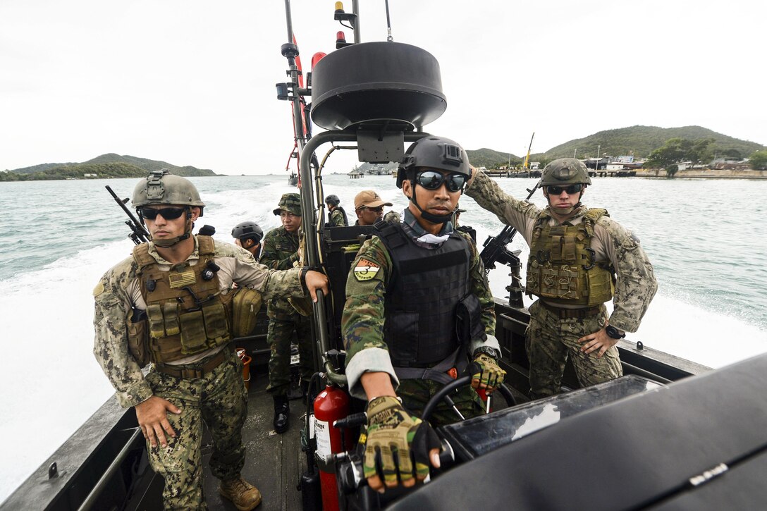 U.S. sailors and members of the Thai navy's riverine patrol regiment train on a special operations craft during Cooperation Afloat Readiness and Training Thailand 2015 in Sattahip, Thailand, Aug. 27, 2015. The U.S. sailors are assigned to Coastal Riverine Squadron 4. In its 21st year, the annual exercise includes the U.S. Navy, U.S. Marine Corps and the armed forces of nine partner nations. U.S. Navy photo by Petty Officer 1st Class Joshua Scott
