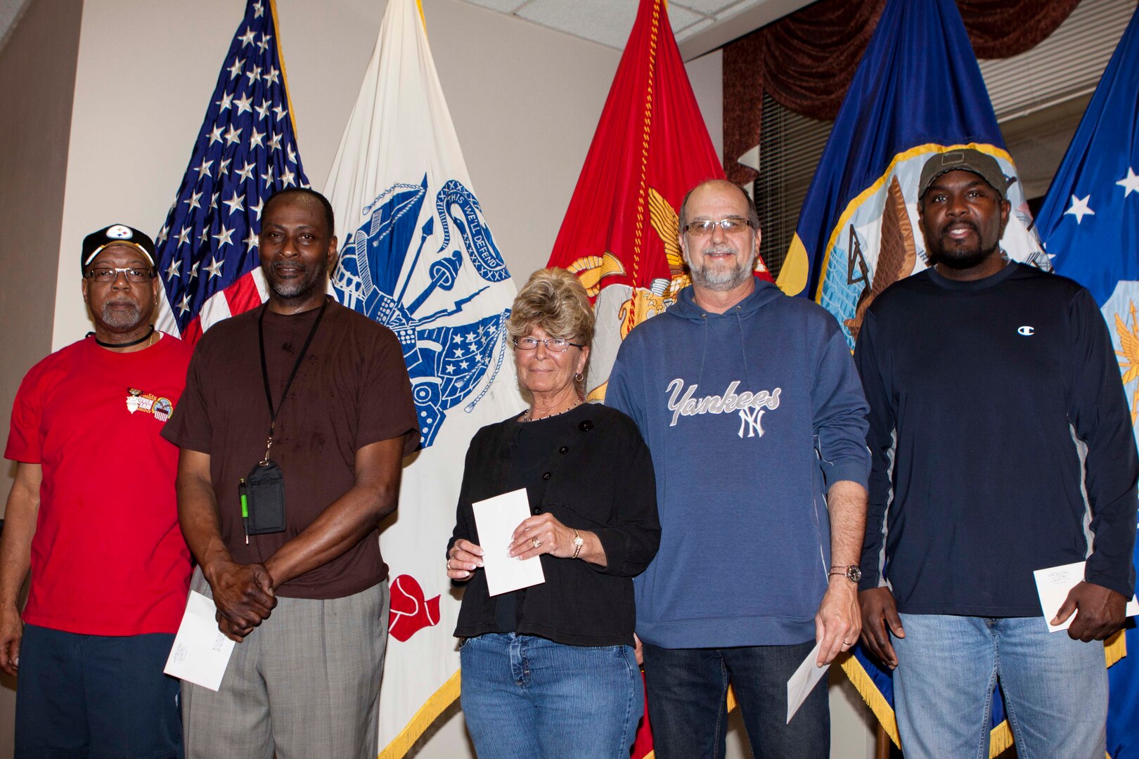 Six DLA Distribution Susquehanna employees are honored for their acts of selfless service and response to a co-worker in distress, including (left to right) Byron Davis, William Taylor, Penny Duprey, Donald Maurice and Regis Hill (not pictured is Joelaniel Borrero-Sanchez). 