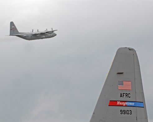 A U.S. Air Force Reserve C-130H Hercules cargo transport aircraft from Youngstown Air Reserve Station, Ohio, takes off during a nine-aircraft formation training mission here, Aug. 27, 2015. The formation included aircraft from Dobbins Air Force Base, Georgia, Mansfield Lahm Air National Guard Base, Ohio, and Bradley Air National Guard Base, Connecticut and flew to a drop zone at Camp Ravenna, Ohio, to air drop palletized cargo before following a tactical flight route through Ohio and Western Pennsylvania. The nine-ship formation was part of a C-130 Round-Up hosted by the 910th Airlift Wing. The Round-Up is a friendly skills competition for aircrew members and aerial porters, with events in cargo loading and unloading, aerial cargo drops, combat landings and formation flying. (Tech. Sgt. Rick Lisum)