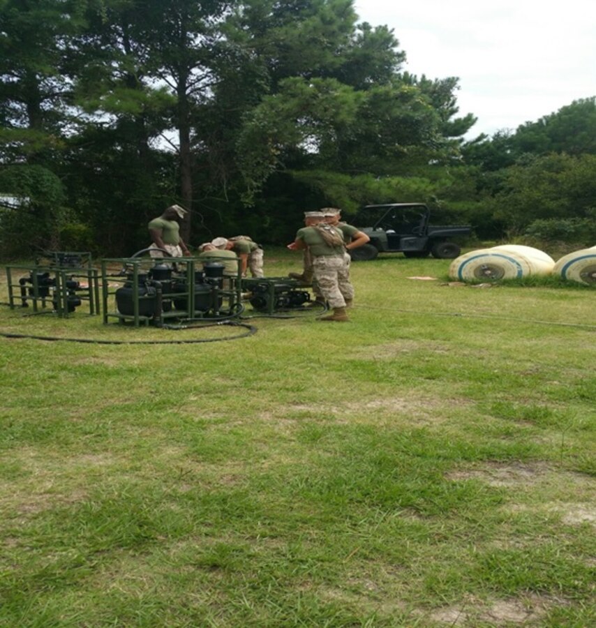Marines from Basic Water Support Technician course 7-15 getting ready for a performance exam on the Light Weight Water Purification System (LWPS) at Marine Corps Engineer School, Camp Lejeune, N.C. August 24, 2015.  This examination will ensure the Marines are well versed in the capabilities, components, operation and repairs of the LWPS in order to supply efficiently potable drinking water to combat units in every climb and place.
