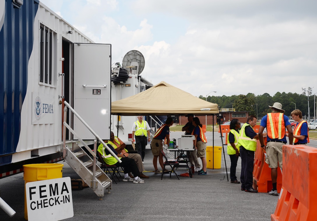 Federal Emergency Management Agency officials pre-stage about 75 trailers at Marine Corps Logistics Base Albany’s Civilian Human Resources Office — Southeast parking lot, in preparation for Tropical Storm Erika, which is forecast to hit Florida, Aug. 31. The FEMA trailers contain emergency supplies - primarily food, water and power generation equipment that may be needed in the event the storm makes landfall early next week and impacts Georgia, or any of its neighboring states, to include Florida and South Carolina.