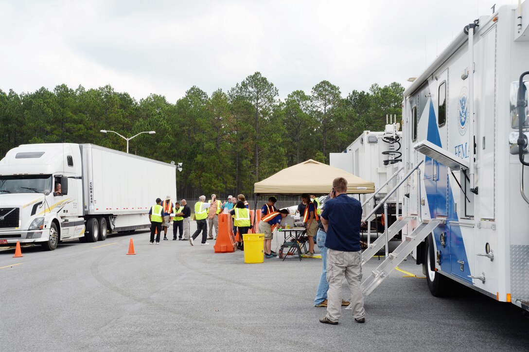 Federal Emergency Management Agency officials pre-stage about 75 trailers at Marine Corps Logistics Base Albany’s Civilian Human Resources Office — Southeast parking lot, in preparation for Tropical Storm Erika, which is forecast to hit Florida, Aug. 31. The FEMA trailers contain emergency supplies - primarily food, water and power generation equipment that may be needed in the event the storm makes landfall early next week and impacts Georgia, or any of its neighboring states, to include Florida and South Carolina.