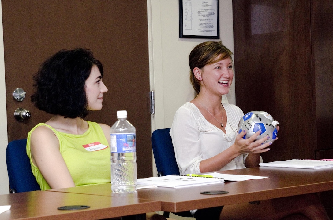 Crystal Croone (right), a Smithfield, Va. native; and Adriana Hahn, a Castro Valley, Calif. native; participate in an ice breaker activity during a Lifestyles, Insights, Networking, Knowledge & Skills class aboard Marine Corps Base Hawaii, Aug. 18, 2015. Volunteer mentors are needed to teach portions of the L.I.N.K.S. class. No teaching experience is necessary. The L.I.N.K.S. class is just one of Marine Corps Community Services Hawaii’s many programs and services offered aboard MCB Hawaii to sustain combat readiness for all operating forces and tenant organizations aboard the installation. (U.S. Marine Corps photo by Kristen Wong/Released)
