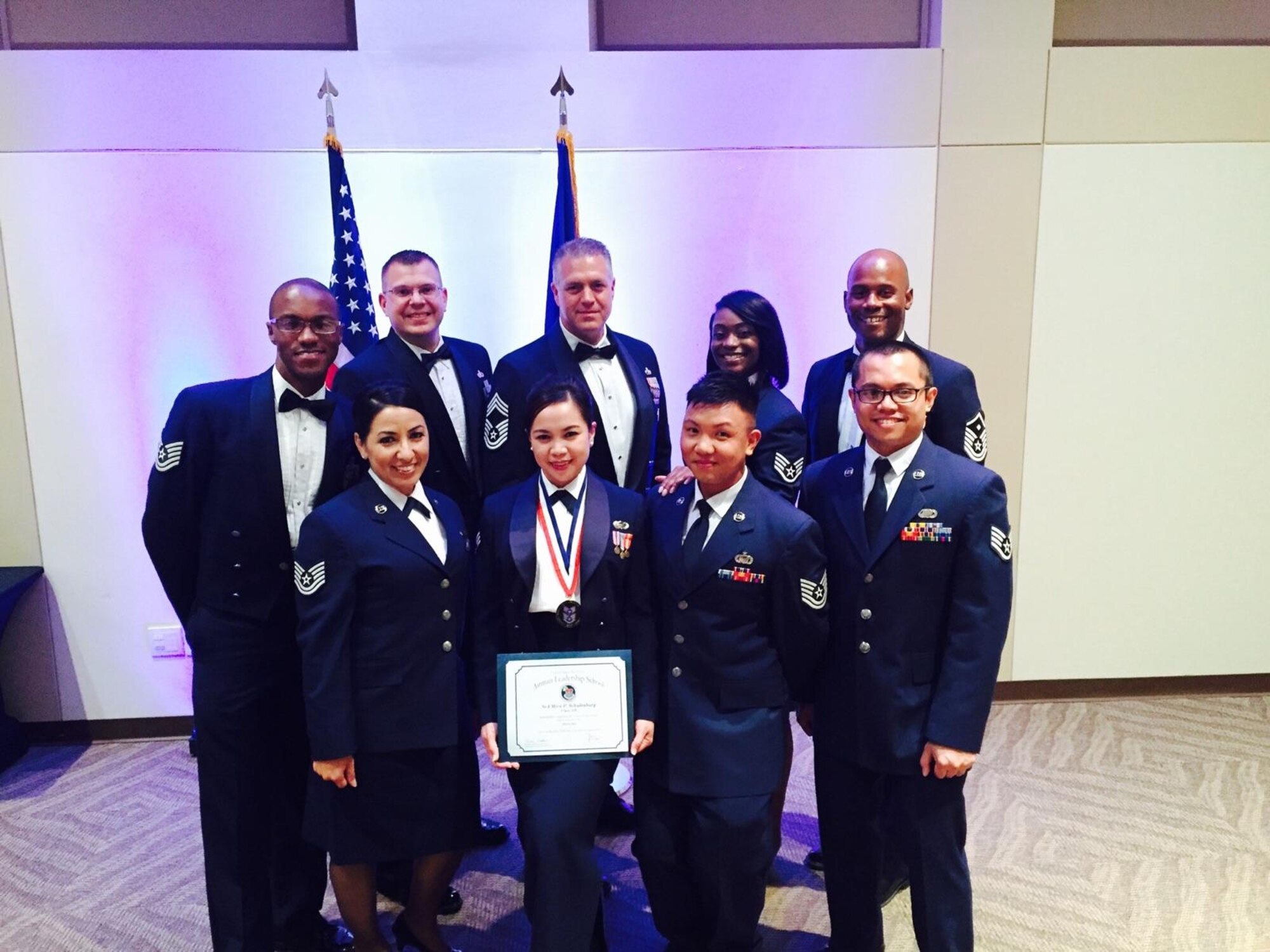 Senior Airman Myra Schulenburg, Air Reserve Personnel Center contact center counselor, stands among classmates first row fourth person from the left, after the Buckley Airman Leadership School Class 15-F graduation at the Leadership Development Center Aug. 27, 2015, on Buckley Air Force Base, Colo. This graduation represents an important part of the enlisted force professional military education, teaching valuable skills required for supervisors. (U.S. Air Force photo by Airman 1st Class Luke W. Nowakowski)