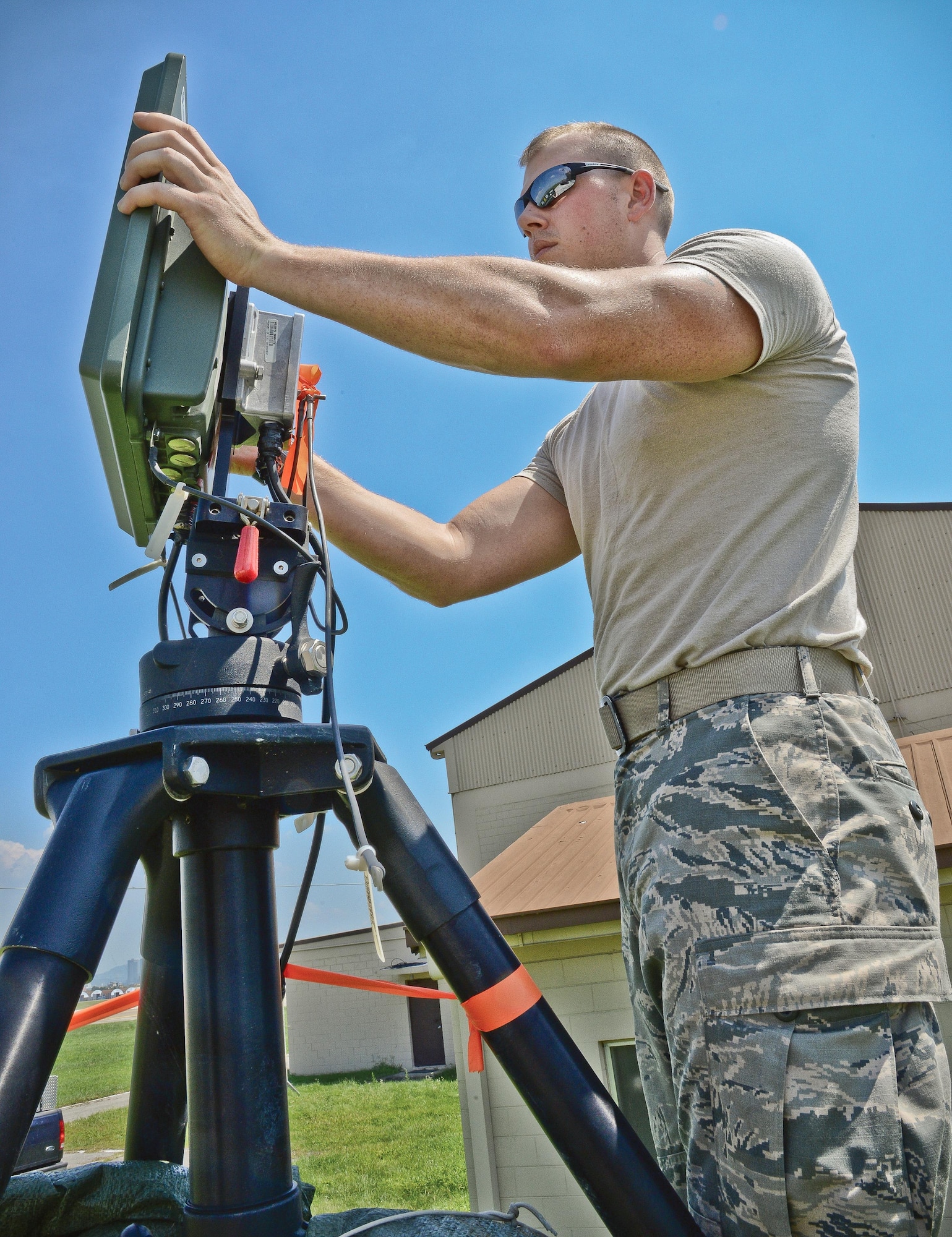 Airman 1st Class John Terkosi, 644th Combat Communications Squadron radio frequency transmissions apprentice, adjusts the angle of a radio frequency kit to improve communications link quality Aug 27, 2015, at Suwon Air Base, Republic of Korea. The RF-K is used to provide uninterrupted communication and ensures redundancies are in place in case a transmission link is lost. The 644th CBCS is in place at Suwon Air Base from Anderson Air Force Base, Guam, to help set up and maintain temporary communications. (U.S. Air Force photo/Tech. Sgt. Travis Edwards-Released)