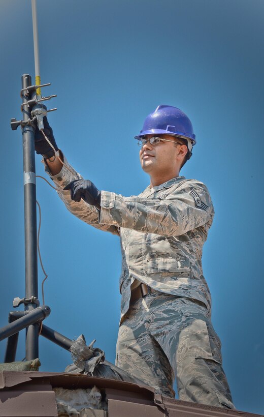 Staff Sgt. Roger Toliver, 644th Combat Communications Squadron radio frequency transmissions supervisor, performs a preventative-maintenance inspection on an antenna to ensure reliable radio communications are maintained. The 644th CBCS is in place at Suwon Air Base from Anderson Air Force Base, Guam, to help set up and maintain temporary communications to support and enable approximately 1,500 sorties during the displacement of Osan Air Base’s assets and personnel. (U.S. Air Force photo/Tech. Sgt. Travis Edwards-Released)