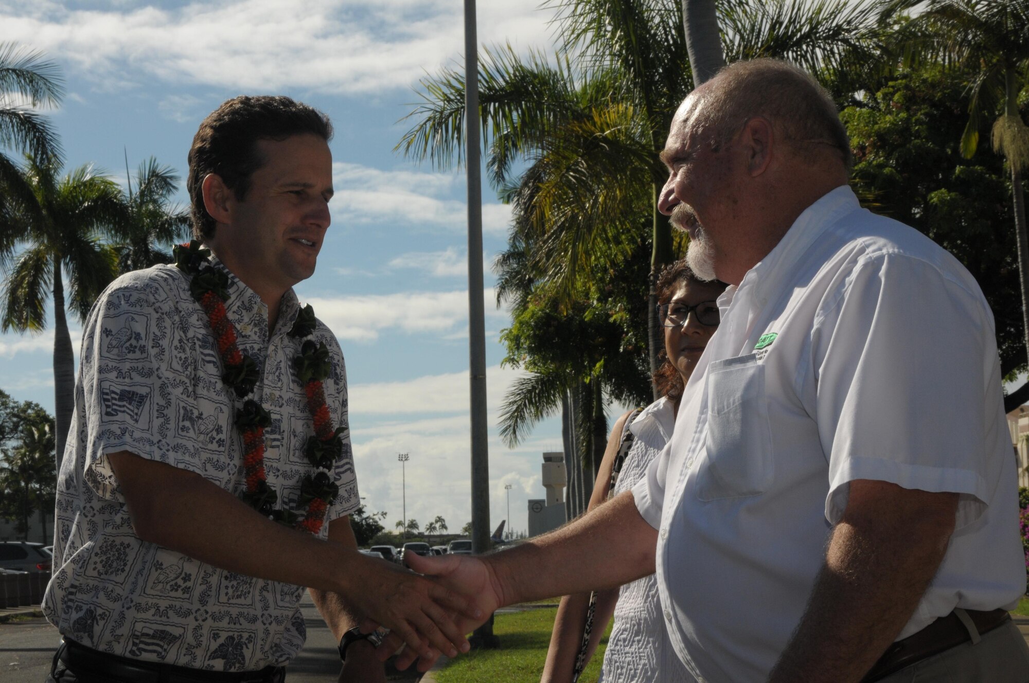 U.S. Senator Brian Schatz, left, is greeted by Stanley Osserman, Director of the Hawaii Center for Advanced Transportation Technology during a visit to the center at Joint Base Pearl Harbor Hickam, Aug. 26, 2015. The tour showcased Joint Base Pearl Harbor-Hickam’s smart energy production, storage and use. (U.S. Air National Guard photo by Senior Master Sgt. Kristen Stanley/released)