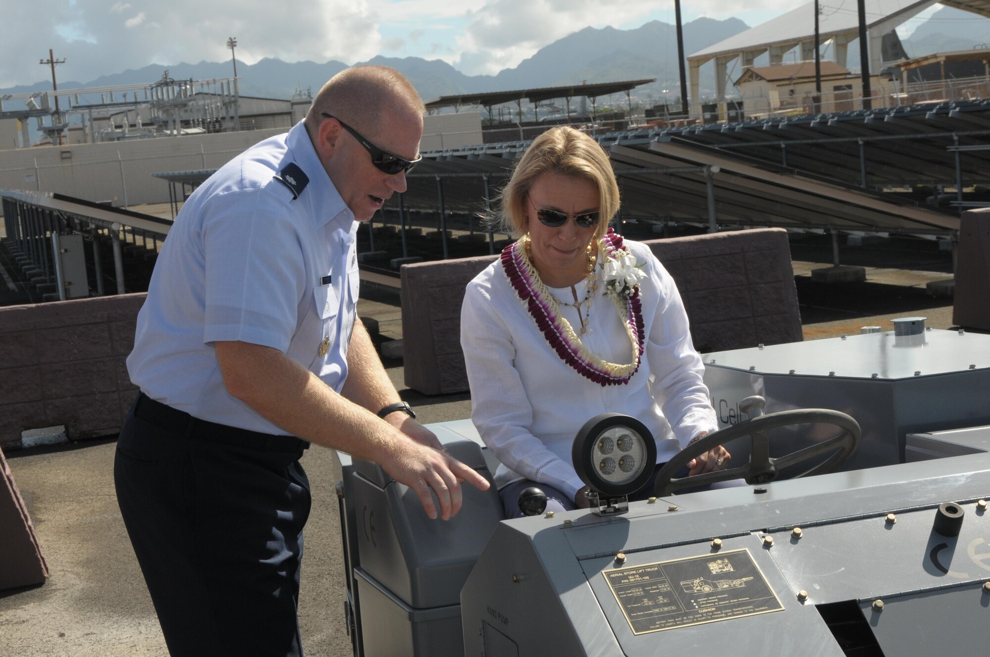 Miranda A. Ballentine, assistant secretary of the Air Force for Installations, Environment, and Energy, is shown the hydrogen fueled weapons loading vehicle used at Joint Base Pearl Harbor-Hickam, Aug. 26, 2015. The Air Force in partnership with the state of Hawaii established a National Demonstration Center to facilitate demonstration and validation of the latest fuel efficient and environmentally compliant technologies for use in Air Force ground vehicles, support equipment, base infrastructure, and basic expeditionary airfield resources. (U.S. Air National Guard photo by Senior Master Sgt. Kristen Stanley/released)