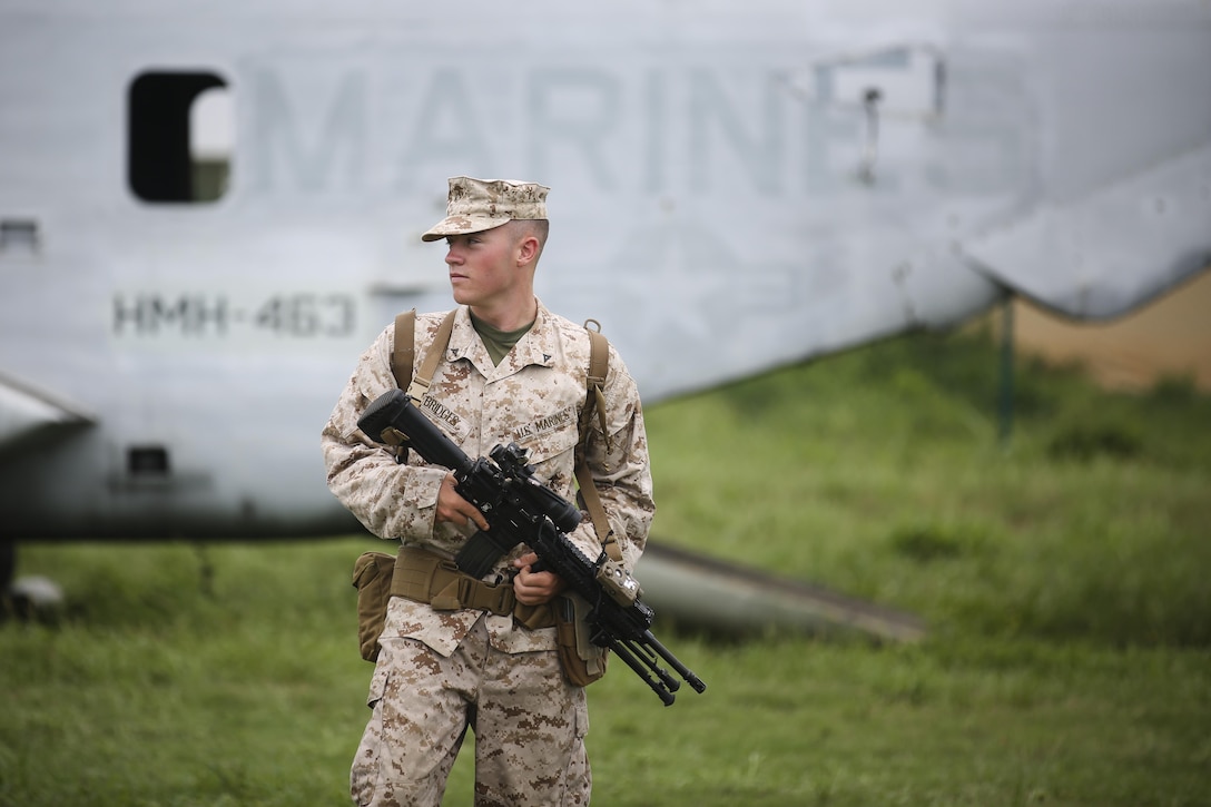 Lance Cpl. Stetson Bridges, an automatic rifleman with India Company, 3rd Battalion, 3rd Marine Regiment, and Lubbock, Texas, native, patrols Boondocker Training Area with his squad while practicing various signals, tactics and maneuvers aboard Marine Corps Base Hawaii, Aug. 24, 2015. The purpose of the training was to prepare the company’s Marines at the squad level, ensuring they are able to efficiently and effectively perform squad attacks and movements. By preparing their Marines for a combat environment, 3rd Bn., 3rd Marines, helps support the mission of MCB Hawaii, which is to enhance and sustain combat readiness for all operating forces and tenant organizations aboard the installation. (U.S. Marine Corps photo by Lance Cpl. Harley Thomas/Released)