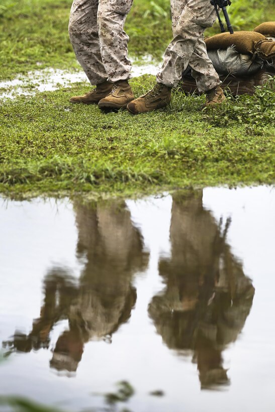 Marines with India Company, 3rd Battalion, 3rd Marine Regiment, practice various signals, tactics and maneuvers at Boondocker Training Area aboard Marine Corps Base Hawaii, Aug. 24, 2015. The purpose of the training was to prepare the company’s Marines at the squad level, ensuring they are able to efficiently and effectively perform squad attacks and movements. By preparing their Marines for a combat environment, 3rd Bn., 3rd Marines, helps support the mission of MCB Hawaii, which is to enhance and sustain combat readiness for all operating forces and tenant organizations aboard the installation. (U.S. Marine Corps photo by Lance Cpl. Harley Thomas/Released)