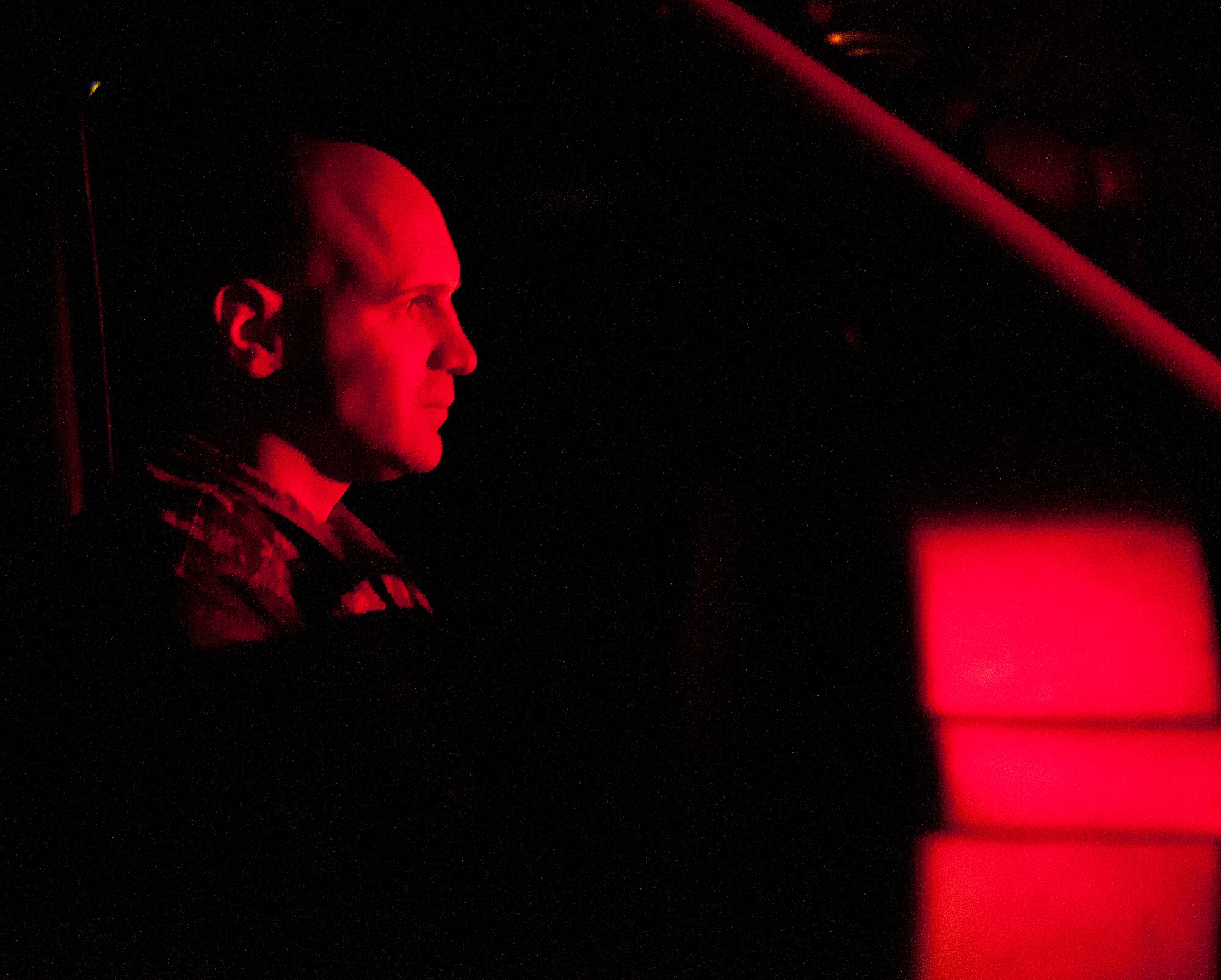 Tech. Sgt. Andreas Niemetschek, 90th Security Forces Squadron Delta Flight chief, stares down his Airmen after they surrounded him in police vehicles during a training exercise Aug. 6, 2015, on F.E. Warren Air Force Base, Wyo. Niemetschek struggled against the Delta Flight defenders as they wrestled him out of the vehicle and handcuffed him on the ground. (U.S. Air Force photo by Senior Airman Jason Wiese/Released)