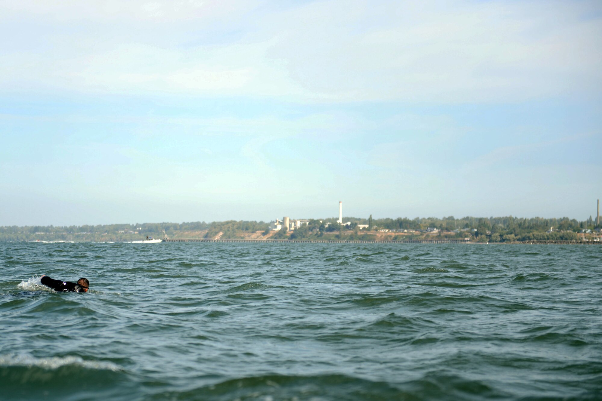 Senior Airman David Knutson, 627th Communication Squadron commander executive assistant, swims in the four mile Swim to Live relay in the Bellingham Bay, Wash., Aug. 24, 2015. The Swim to Live relay event was founded to raise awareness of and educate communities on the causes and effects of military Post-Traumatic Stress Disorder, to pay tribute to the military members who lost their lives due to PTSD, and to give military members an opportunity to face their own personal challenges while honoring their lost comrades. (U.S. Air Force photo/Staff Sgt. Katie Jackson)