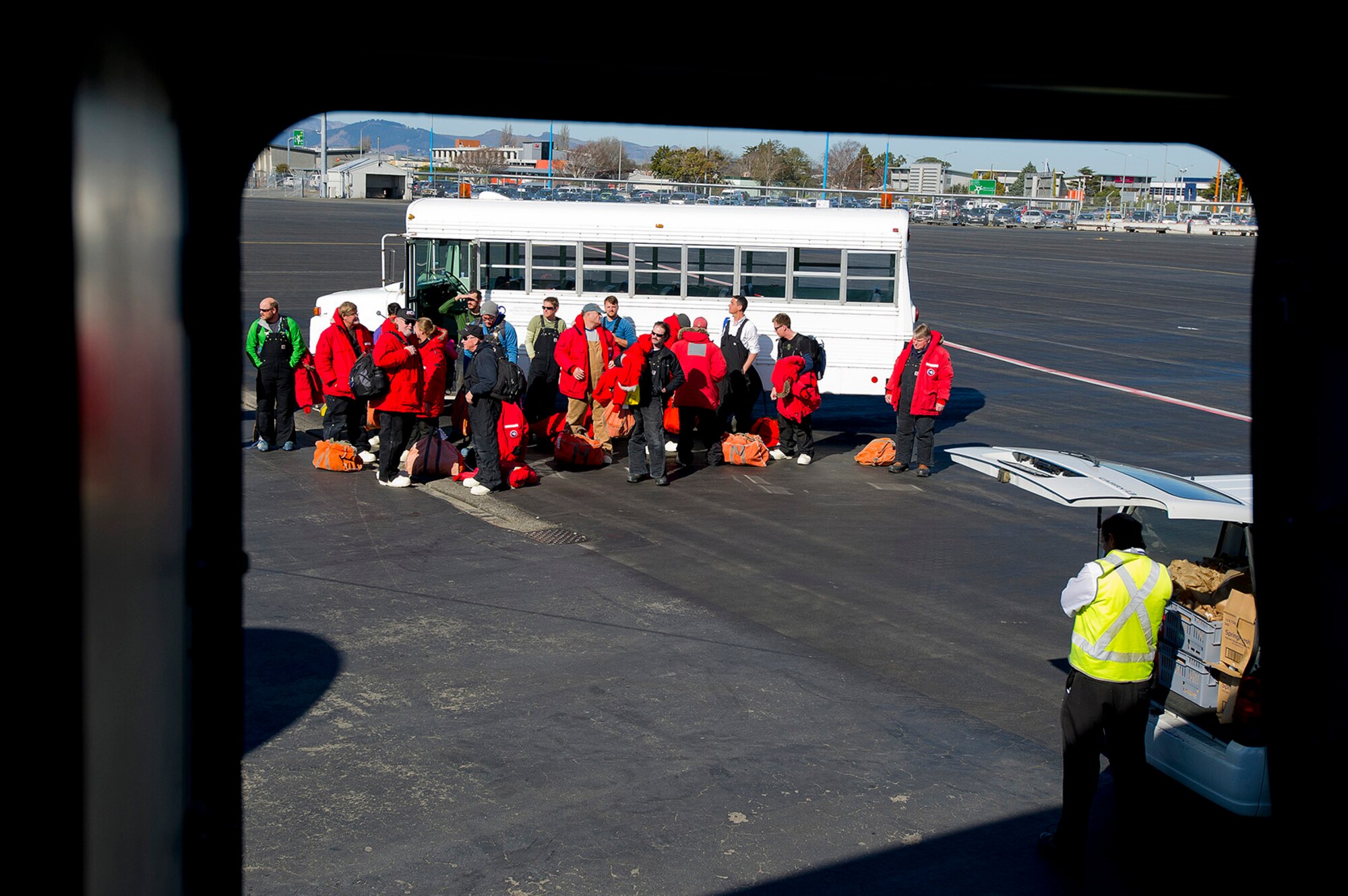 Passengers traveling to the National Science Foundation’s McMurdo Station, Antarctica, arrive on the flight line and prepare to board a U.S. Air Force C-17 Globemaster III at Christchurch International Airport, New Zealand, Aug. 23, 2015. These men and women will be flying down to work for the NSF-managed United States Antarctic Program. (U.S. Air Force photo by Senior Airman Madelyn McCullough)
