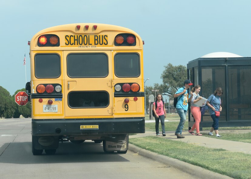 ALTUS AIR FORCE BASE, Okla. – Children get off the Altus Public Schools’ bus in base housing, Aug. 28, 2015. The localschool year begain Aug. 11 and parents are encouraged to talk to their children about ways to stay safe as the school year progesses.