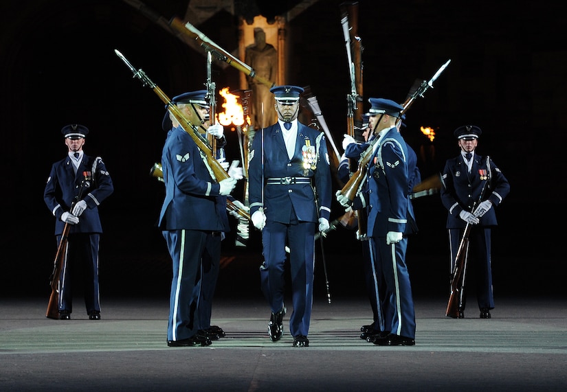 The United States Air Force Honor Guard Drill Team performs during The Royal Edinburgh Military Tattoo on the Esplanade of the Edinburgh Castle in Edinburgh; Scotland Aug. 17; 2015. This is the 66th production of the tattoo and it welcomes more than 220; 000 spectators from around the world for more than 3 weeks. (U.S. Air Force photo/Staff Sgt. Nichelle Anderson/Released)