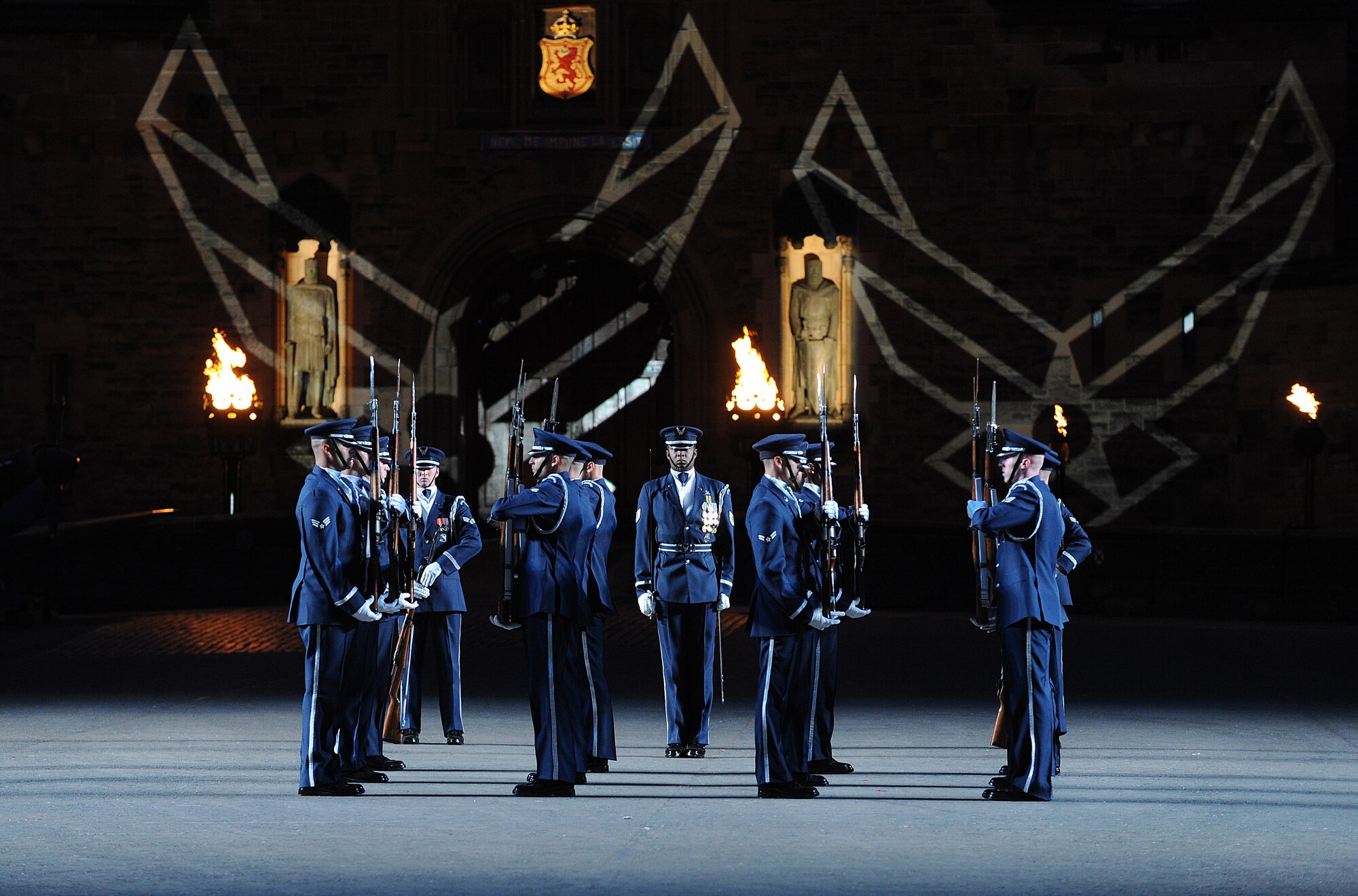 The United States Air Force Honor Guard Drill Team performs during The Royal Edinburgh Military Tattoo on the Esplanade of the Edinburgh Castle in Edinburgh; Scotland Aug. 17; 2015. This is the 66th production of the tattoo and it welcomes more than 220; 000 spectators from around the world for more than 3 weeks. (U.S. Air Force photo/Staff Sgt. Nichelle Anderson/Released)