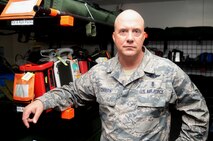 Chief Master Sgt. Rodney Christa, 433rd Aeromedical Evacuation Squadron superintendent, showcases the units medical deployment packages that are used for natural disaster relief Aug. 27, 2015 at Joint Base San Antonio-Lackland, Texas. Christa supported the evacuation and transport of evacuees during Hurricane Katrina. The mission of Aeromedical Evacuation Squadrons are to provide  highly trained crews that are equipped to provide in-flight medical care aboard mission directed aircraft used to airlift patients. (U.S. Air Force photo by Benjamin Faske)(released)