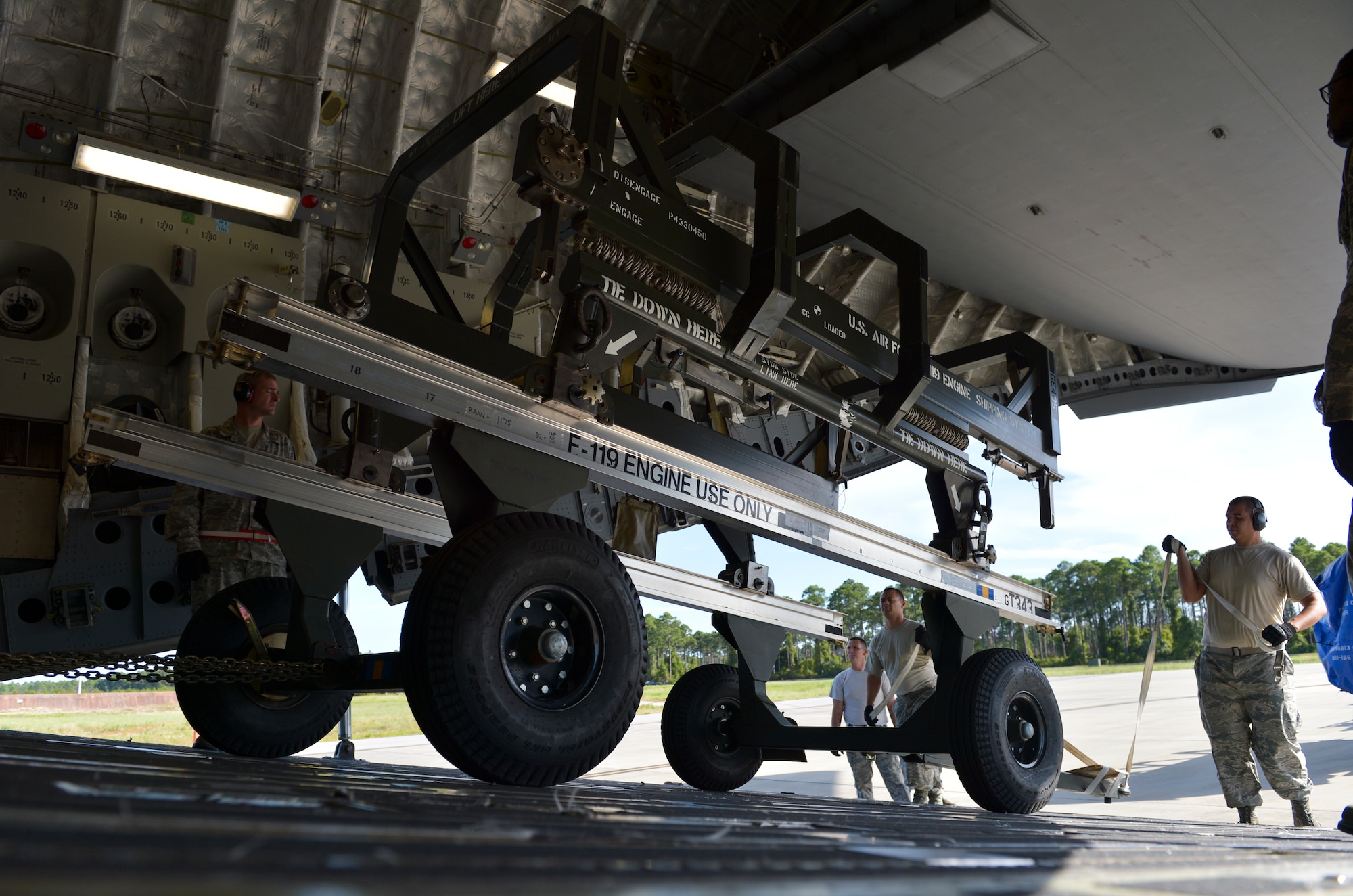 Tyndall Airmen load a C-17 Globemaster III with cargo necessary for the first-ever F-22 training deployment to Europe at Tyndall. The deployment is in direct support to the European Reassurance Initiative and will allow for F-22 pilots to train alongside joint partners, NATO allies and other U.S. Air Force aircraft. (U.S. Air Force photo by Tech. Sgt. Javier Cruz/Released)