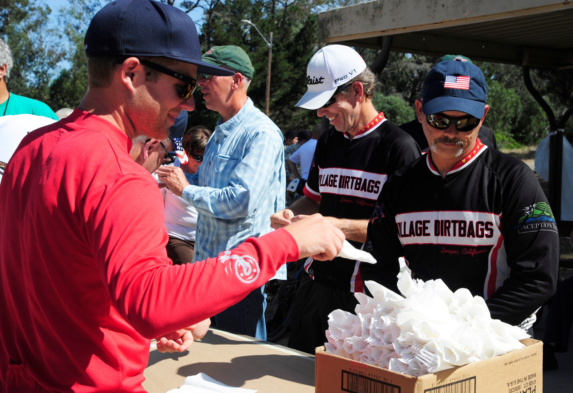 Members of the Lompoc Chamber of Commerce and Noncommissioned Officers Association help set up the annual military appreciation barbeque, Aug. 28, 2015, on Vandenberg Air Force Base, Calif. The annual barbeque is simply one way to show gratitude toward those who have answered their nation's call. (U.S. Air Force photo by Senior Airman Kyla Gifford/Released)