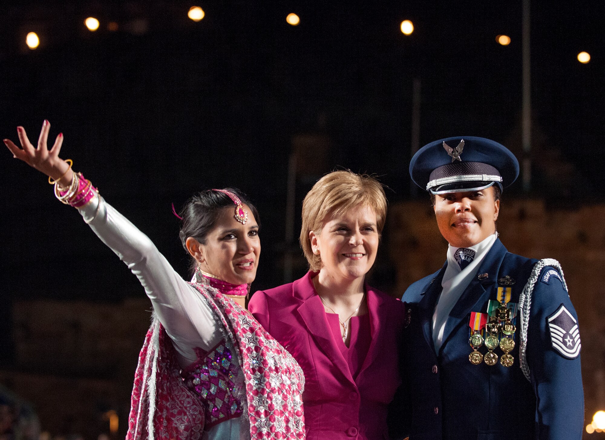 First Minister of Scotland, Nicola Sturgeon, meets with Bollywood dancer, Rea Krishnat Raye and United States Air Force Honor Guard Drill Team superintendent, Master Sgt. Tameka Woods during the Royal Edinburgh Military Tattoo Aug. 15, 2015 in Edinburgh, Scotland. Their meeting depicted this year's tattoo theme, "East Meets West: a celebration of the richness of international culture and the creative spirit of human endeavor." The tattoo brought together more than 1,390 performers from the U.S., Europe, Asia, Australia and Canada. (U.S. Air Force photo/Staff Sgt. Nichelle Anderson/released)