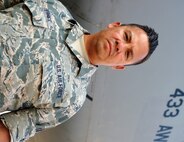 Master Sgt. Anthony Gutierrez, 433rd Aircraft Maintenance Squadron flying crew chief, works on an awaiting C-5A Galaxy aircraft Aug. 28, 2015 at Joint Base San Antonio-Lackland, Texas. MSgt. Gutierrez supported the evacuation and transport of evacuees during Hurricane Katrina. Aircraft Maintenance specialists are responsible for ensuring everything from tip to tail is maintained on the aircraft.   (U.S. Air Force photo by SrA Bryan Swink)(released)
