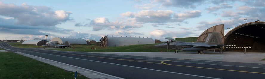 U.S. Air Force F-22 Raptor fighter aircraft assigned to the 95th Fighter Squadron at Tyndall Air Force Base, Fla., park outside hardened aircraft shelters Aug. 28, 2015, on Spangdahlem Air Base, Germany. During this inaugural deployment to Europe, the 95th FS pilots will conduct familiarization flight training within the European theater as well as conduct dissimilar aircraft training with F-15 Eagles and F-16 Fighting Falcon fighter aircraft from U.S. Air Forces in Europe units. (U.S. Air Force photo by Staff Sgt. Christopher Ruano/Released)