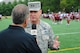 Air Force District of Washington Commander Maj. Gen. Darryl Burke is interviewed by Larry Michael, Redskin’s Broadcast Network, as the Washington Redskins conduct a walkthrough practice at the fitness center's field, Joint Base Andrews, Md. on Aug. 28, 2015. The Redskins spent time meeting with Airmen, Sailors and Marines, family members and local school children and their chaperones to show their appreciation to the military community. The Redskins conducted the practice and signed autographs as part of their Redskins Salute effort. (U.S. Air Force photo/James E. Lotz)
