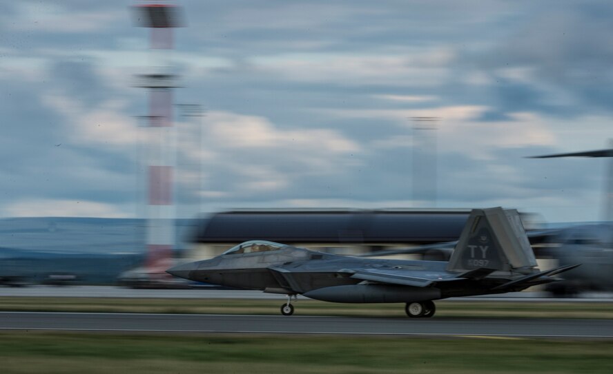 A U.S. Air Force F-22 Raptor fighter aircraft pilot assigned to the 95th Fighter Squadron at Tyndall Air Force Base, Fla., lands on the runway Aug. 28, 2015, at Spangdahlem Air Base, Germany. The U.S. Air Force deployed four F-22 Raptors, one C-17 Globemaster III, and approximately 60 Airmen and associated equipment to Spangdahlem, to train with NATO allies and partners. These relationships are critical to ensuring safety, and stability in the European region. The forward presence allows the rotation of units from the U.S. to augment the forces in Europe whenever needed. (U.S. Air Force photo by Staff Sgt. Christopher Ruano/Released)