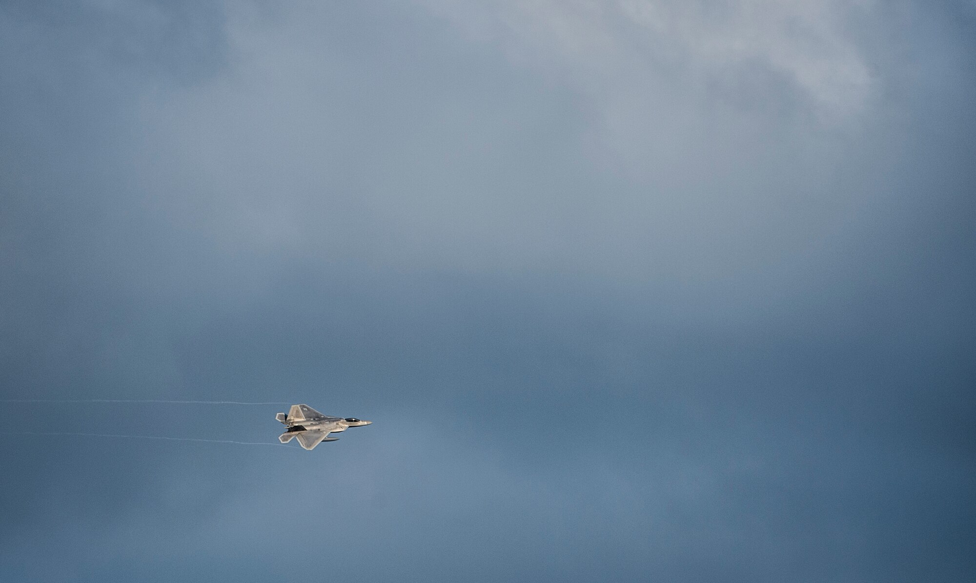 A U.S. Air Force F-22 Raptor fighter aircraft pilot assigned to the 95th Fighter Squadron at Tyndall Air Force Base, Fla., prepares to land on the runway Aug. 28, 2015, at Spangdahlem Air Base, Germany. This is the first training deployment of the F-22 Raptor in the U.S. European Command theater. The U.S. values the shared commitment and close cooperation with NATO allies on countering a range of regional and global threats. (U.S. Air Force photo by Staff Sgt. Christopher Ruano/Released)