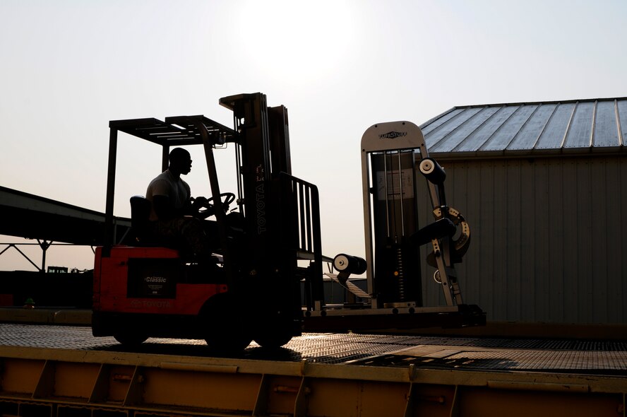 Staff Sgt. Richard Green loads gym equipment onto a truck, Aug. 26, 2015, at Ebbing Air National Guard Base, Ark. The equipment will be taken to Defense Reutilization and Marketing Office in Hooks, Texas. Green is assigned to the 188th Logistics Readiness Squadron. (U.S. Air National Guard photo by Staff Sgt. Hannah Dickerson/Released)