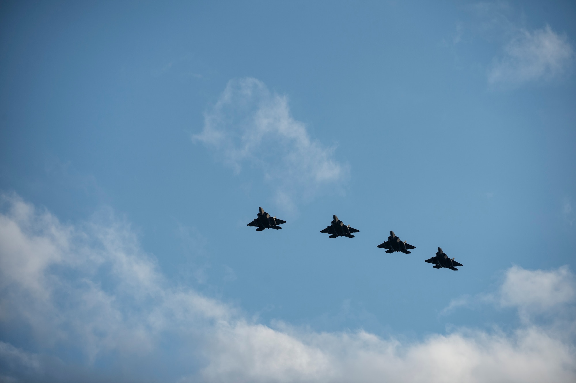 U.S. Air Force F-22 Raptor fighter aircraft pilots assigned to the 95th Fighter Squadron at Tyndall Air Force Base, Fla., fly in formation Aug. 28, 2015, over Spangdahlem Air Base, Germany. This is the first training deployment of the F-22 Raptor in the U.S. European Command theater. The U.S. values the shared commitment and close cooperation with NATO allies on countering a range of regional and global threats. (U.S. Air Force photo by Staff Sgt. Christopher Ruano/Released)