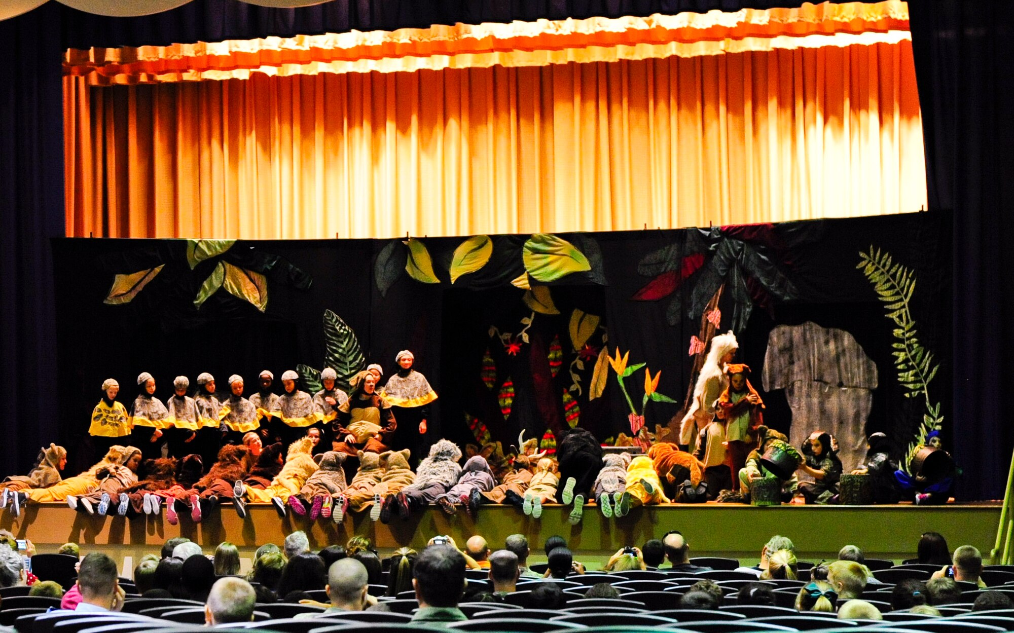 Children perform "Jungle Book" in the base theater at MacDill Air Force Base, Fla., Aug. 21, 2015. The 5-day preparation involved auditions on Monday, followed by practice throughout the week and a performance on Friday. (U.S. Air Force photo by Airman 1st Class Mariette M. Adams/Released)